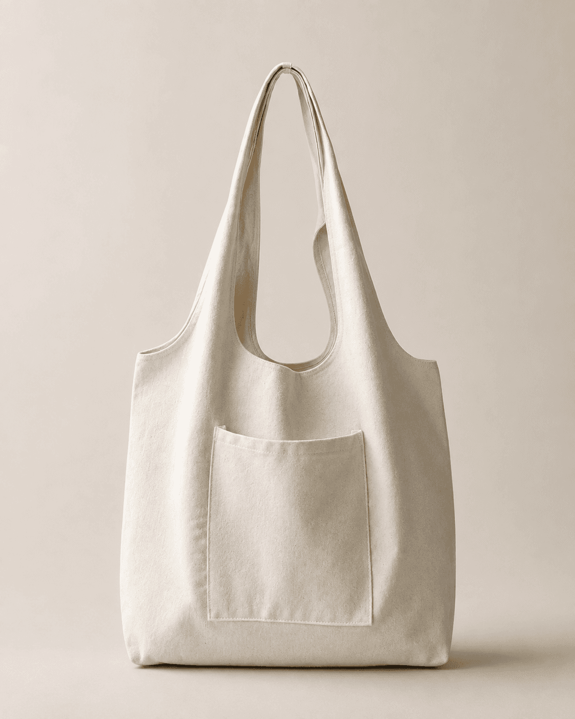 Plain natural canvas tote bag with a front pocket