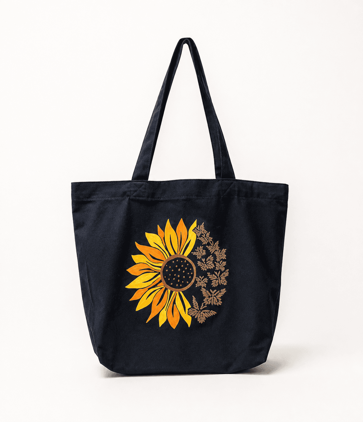 Black tote bag hand-painted with a sunflower and butterfly design