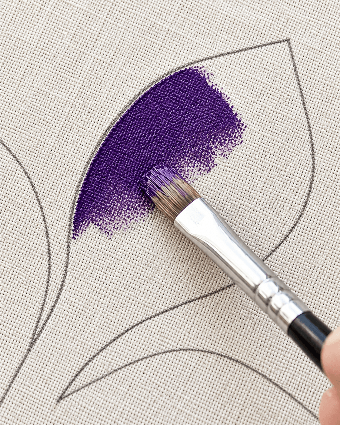 Hand-painted design detail on a tote bag